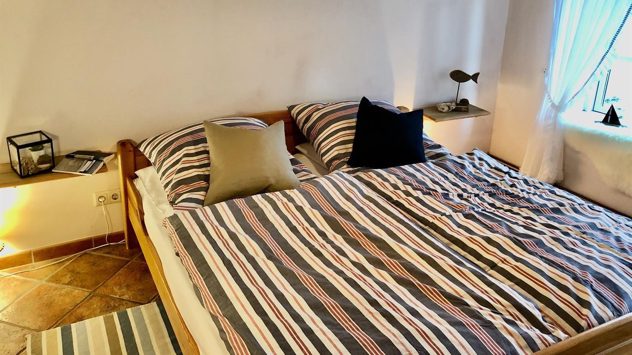 Ebenso im maritimen Stil das 2. Schlafzimmer Ebenso im maritimen Stil das 2. Schlafzimmer